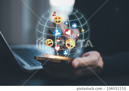 business people holding smartphones and Social media and digital online concept, a smartphone with Social media, the concept of living on vacation and playing social media. Social Distancing 106052150