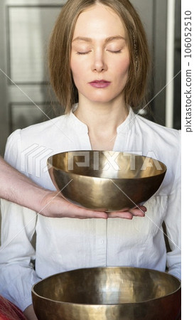 Tibetan singing bowls in sound therapy in spa center Tibetan singing bowls in sound therapy in spa center 106052510
