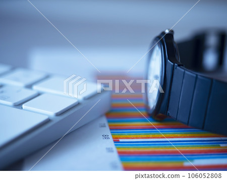 Graph, keyboard and clock on the table Graph, keyboard and clock on the table 106052808