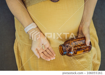 Prenatal Vitamins. Portrait Of Beautiful Smiling Pregnant Woman Holding Transparent Glass Jar With Pills, Taking Supplements For Healthy Pregnancy While Sitting On Couch At Home, Free Space Prenatal Vitamins. Portrait Of Beautiful Smiling Pregnant Woman Holding Transparent Glass Jar With Pills, Taking Supplements For Healthy Pregnancy While Sitting On Couch At Home, Free Space 106055161