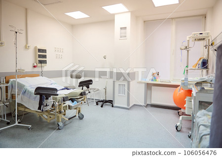 Interior of an empty hospital ward in a modern maternity clinic. Childbirth. Delivery. Labor concept. Obstetrics and gynecology. 106056476