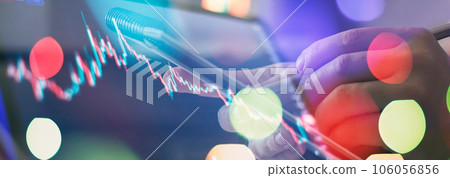 Businessman hand working on analyzing investment charts. financial and investment Businessman hand working on analyzing investment charts. financial and investment 106056856