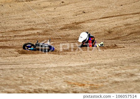 Motocross child rider falling Motocross child rider falling 106057514