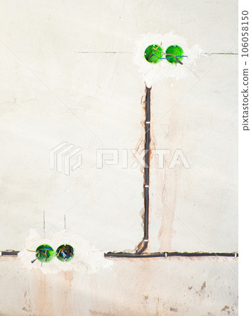 Plastic backbox for sockets or switches inserted into the drilled holes on wall 106058150