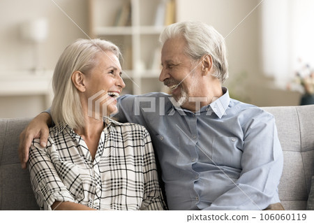 Happy loving senior retired husband and wife hugging with warmth Happy loving senior retired husband and wife hugging with warmth 106060119