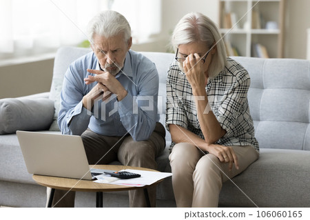 Worried senior retired husband and wife stressed about financial crisis Worried senior retired husband and wife stressed about financial crisis 106060165