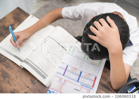 Image of a child who has difficulty studying, taking an exam, etc. Image of a child who has difficulty studying, taking an exam, etc. 106060318