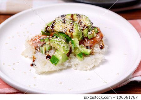 Sushi Waffles food trend, made with a crispy rice waffle and topped off with salmon, cucumber, and avocado. 106061767