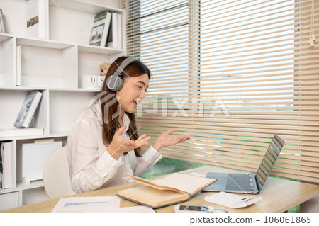 Young woman Working from Home, Video Call with Customer in Office, Remote Business Communication, Telecommuting Professional, Virtual Video Call with Office Customer, Work from Home Concept. 106061865