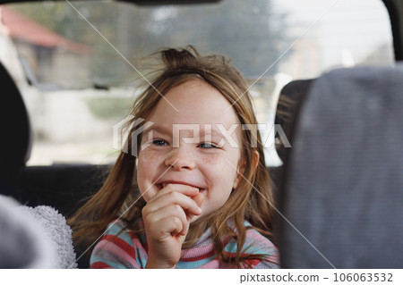Cute child girl laughing indoor portrait 106063532
