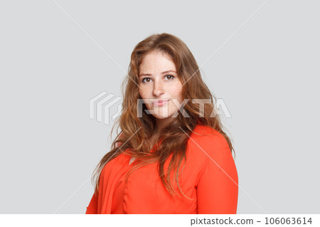 Pretty female model in red blouse posing on white background, studio portrait Pretty female model in red blouse posing on white background, studio portrait 106063614