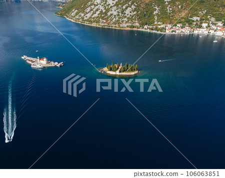 Aerial view of Our Lady of the Rocks or Gospa od Skrpjela and Catholic monastery Saint George in the bay of Kotor, in city of Perast, Adriatic sea, Montenegro. Tourism destination Aerial view of Our Lady of the Rocks or Gospa od Skrpjela and Catholic monastery Saint George in the bay of Kotor, in city of Perast, Adriatic sea, Montenegro. Tourism destination 106063851