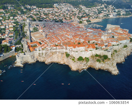 Aerial view of rooftops of Dubrovnik old historical town and Adriatic sea in Croatia. UNESCO World Heritage site, Famous tourist attraction. Vacation and adventure 106063854