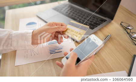 Women use smart phone to register online purchases using credit card payments, Technology for the use of smartphones for business or online financial transactions, Shopping online concept. Women use smart phone to register online purchases using credit card payments, Technology for the use of smartphones for business or online financial transactions, Shopping online concept. 106064560