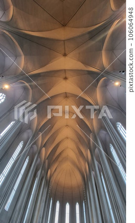 Interior of hallgrimur church with majestic ceiling and huge windows, beautiful decorations and holy sacred design in iceland. Church of hallgrimskirkja decorated as lutheran monument. Interior of hallgrimur church with majestic ceiling and huge windows, beautiful decorations and holy sacred design in iceland. Church of hallgrimskirkja decorated as lutheran monument. 106064948