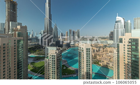 Panorama showing Dubai Downtown cityscape with tallest skyscrapers around aerial timelapse. 106065055