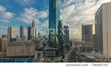 Dubai International Financial district aerial night to day timelapse. Panoramic view of business office towers. 106065101