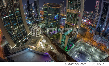 Dubai international financial center skyscrapers aerial all night timelapse. Dubai international financial center skyscrapers aerial all night timelapse. 106065148