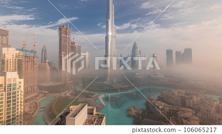 Aerial view of Dubai city early morning during fog timelapse. Aerial view of Dubai city early morning during fog timelapse. 106065217