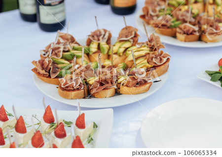 A light appetizer for guests at a wedding buffet. Waiting for a wedding ceremony A light appetizer for guests at a wedding buffet. Waiting for a wedding ceremony 106065334