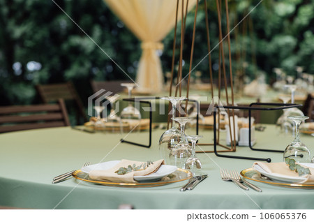 Open air wedding restaurant decorated with fresh flowers and premium dishes Open air wedding restaurant decorated with fresh flowers and premium dishes 106065376