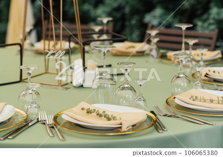 Open air wedding restaurant decorated with fresh flowers and premium dishes Open air wedding restaurant decorated with fresh flowers and premium dishes 106065380