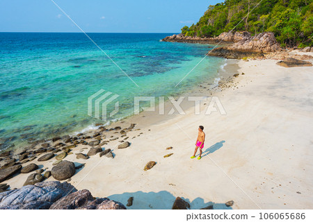 Asian traveler at secluded Pantai Galah Beach on Ko Lipe, Thailand. 106065686