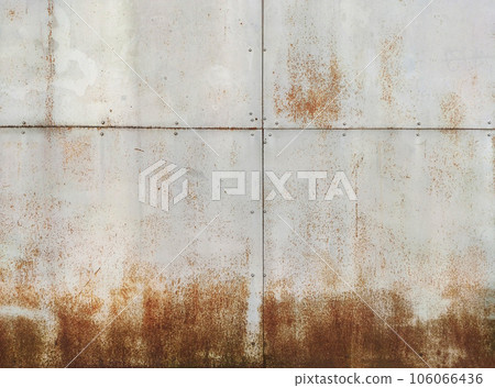 Marks and rust patterns on metal containers. Rusty corrosion and oxidized background. Worn metallic iron rusty metal background Marks and rust patterns on metal containers. Rusty corrosion and oxidized background. Worn metallic iron rusty metal background 106066436
