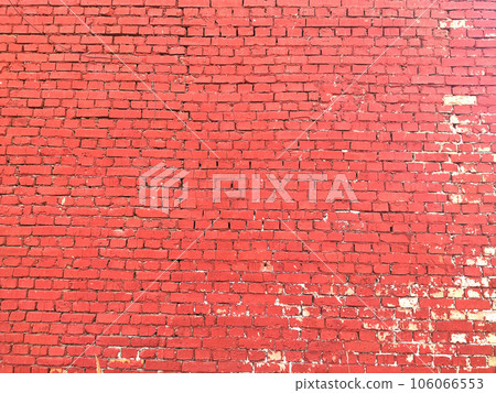Colorful brick wall on the house. Texture of red stone blocks, close up. Background. Colorful brick wall on the house. Texture of red stone blocks, close up. Background. 106066553