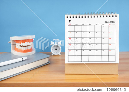 September monthly desk calendar for 2023 year and model dentures on table. Dental health concepts. September monthly desk calendar for 2023 year and model dentures on table. Dental health concepts. 106066843