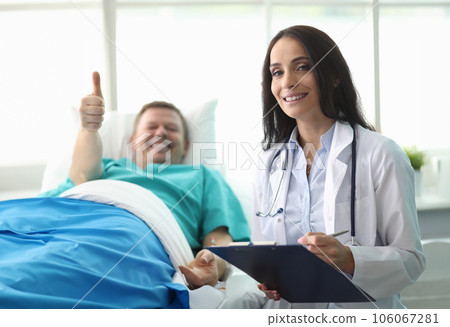 Man hospital bed shows gesture approval doctor 106067281