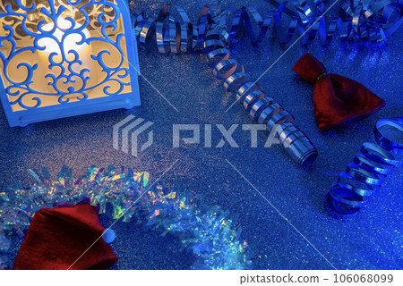 Christmas candles with Christmas tree decorations and a white candlestick house, Christmas card with candle and rain. 106068099