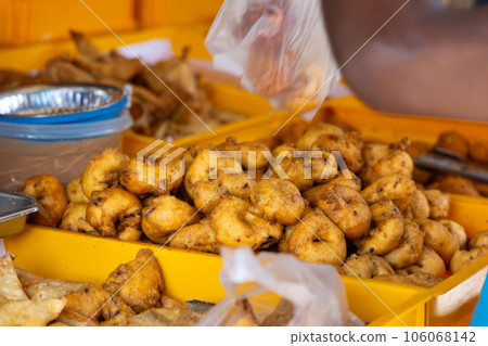 Delicious fried snacks at a street food stall in Asia Delicious fried snacks at a street food stall in Asia 106068142