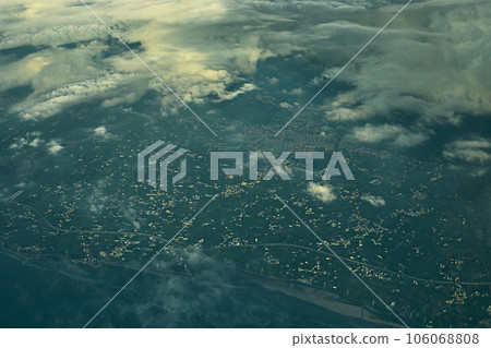 Aerial view of cityscape under clouds 106068808