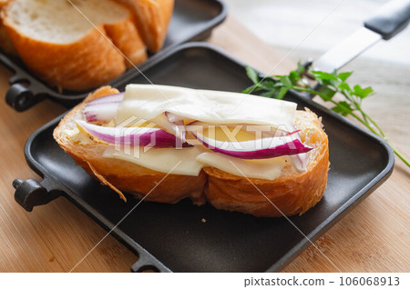 Making hot sandwiches 106068913