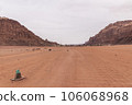 Planet Mars like landscape - Photo of Wadi Rum desert in Jordan with red pink sky above, this location was used as set for many science fiction movies 106068968