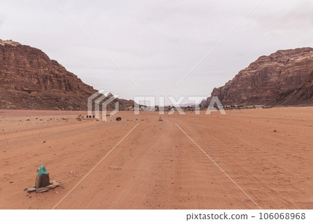 Planet Mars like landscape - Photo of Wadi Rum desert in Jordan with red pink sky above, this location was used as set for many science fiction movies Planet Mars like landscape - Photo of Wadi Rum desert in Jordan with red pink sky above, this location was used as set for many science fiction movies 106068968