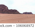 Planet Mars like landscape - Photo of Wadi Rum desert in Jordan with red pink sky above, this location was used as set for many science fiction movies 106068972