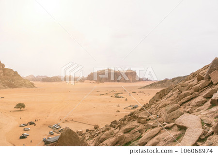 Planet Mars like landscape - Photo of Wadi Rum desert in Jordan with red pink sky above, this location was used as set for many science fiction movies Planet Mars like landscape - Photo of Wadi Rum desert in Jordan with red pink sky above, this location was used as set for many science fiction movies 106068974