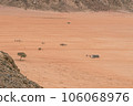 Planet Mars like landscape - Photo of Wadi Rum desert in Jordan with red pink sky above, this location was used as set for many science fiction movies 106068976