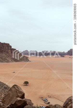 Planet Mars like landscape - Photo of Wadi Rum desert in Jordan with red pink sky above, this location was used as set for many science fiction movies Planet Mars like landscape - Photo of Wadi Rum desert in Jordan with red pink sky above, this location was used as set for many science fiction movies 106069003