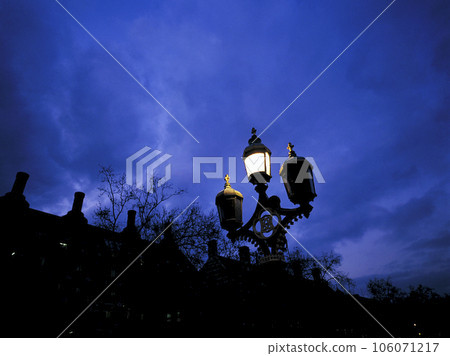 A street lamp near Westminster Bridge lights up A street lamp near Westminster Bridge lights up 106071217