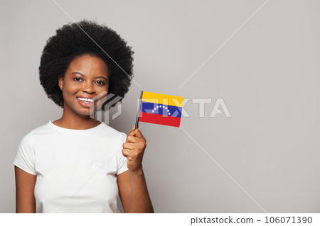 Venezuelan woman holding flag of Venezuela Education, business, citizenship and patriotism concept 106071390
