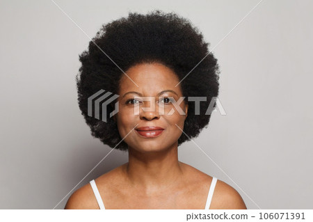 Healthy mature model woman looking at camera. Female face 106071391