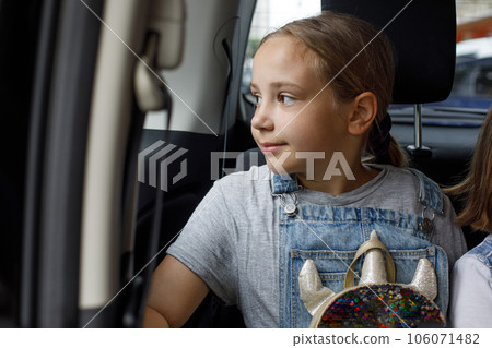 Cheerful child girl enjoying travel and vacation indoor 106071482