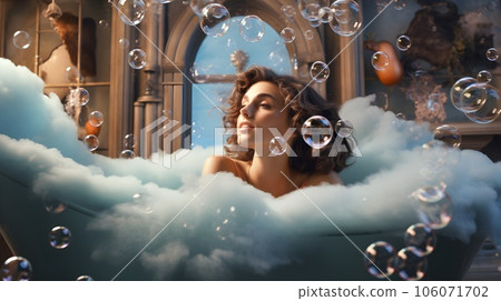 Young woman lying in bathtub 106071702