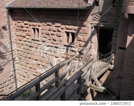 Wooden bridge in castle of Koenigsbourg in Orschwiller in France 106071972