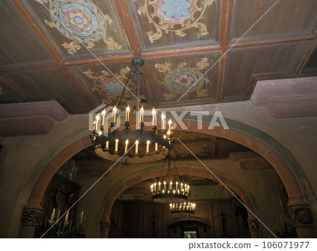Wooden ceiling with chandeliers in chamber of Koenigsbourg castle in France 106071977