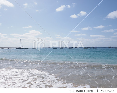 Atlantic Ocean with boats on Sal island in Cape Verde 106072022