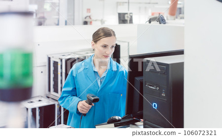 electrical engineer working in electronics manufacturing electrical engineer working in electronics manufacturing 106072321